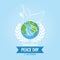 Internationl Peace Day logo or banner with white dove on the earth