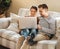 The internet has just what you need to keep busy. a young couple using a laptop while relaxing at home.