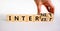 Internet and interest symbol. Businessman turns wooden cubes and changes the words interest to internet. Beautiful white