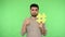 Internet popularity. Smiling brunette man pointing at big yellow hashtag symbol and showing thumbs up, chroma key