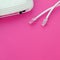 Internet router and Internet cable plugs lie on a bright pink background. Items required for Internet