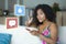 Internet social media app likes and chat comments icons composite on young beautiful and happy mixed ethnicity black African