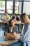 Interracial businesswomen playing chess near blurred