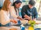 Interracial couple of African husband and Caucasian wife prepare food together with a professional chef