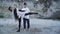 Interracial couple dancing in free style outdoors. Asian guy and caucasian girl dancing contemporary dance. Teenagers in