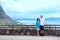 Interracial couple in forties by railing in Hawaii