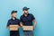 interracial couriers holding parcels and smiling