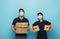 interracial couriers in medical masks looking