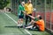 interracial elderly football players shaking hands after match