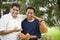 Interracial father and son with baseball gloves