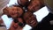 Interracial group of students leaned over the camera against the sky. Close portrait of five young students, tolerance