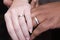 Interracial hands with wedding rings