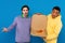 interracial hipsters holding box with pizza