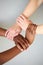 interracial human hands keeping in chains for friendship and love