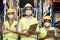 Interracial warehouse worker team with face mask