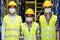 Interracial warehouse worker team with face mask