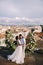 Interracial wedding couple. Destination fine-art wedding in Florence, Italy. A wedding ceremony on the roof of the