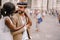 Interracial wedding couple. Wedding in Florence, Italy. African-American bride hugs from behind a Caucasian groom.