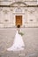 Interracial wedding couple. Wedding in Florence, Italy. African-American bride in a white dress with a bouquet in her