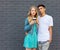 Interracial young couple in love outdoor. Stunning sensual outdoor portrait of young stylish fashion couple posing in summer. Girl