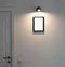 Interrior photo with lamp , door and mock up frame with place for text or picture on the wall. Minimalistic style