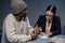 In the interrogation room, a suspect in a drug distribution and possession case consults with a public defender