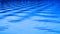 Intersecting waves on blue lake ripple in abstract