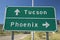 A interstate highway sign in Arizona directing traffic to Tucson and Phoenix, AZ