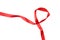 Intertwined red ribbon separating white background