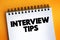 Interview Tips text on notepad, concept background