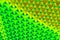 Interwoven rainbow background pattern in yellow, green and blue