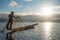 Intha fisherman on boat in Inle lake, Myanmar