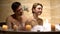 Intimate moment of couple in bathtub, spending romantic evening together