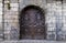 Intramuros, Manila, Philippines - An ornately designed wooden door, the side entrance to San Agustin Church