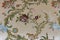 intricate and colorful textile embroidery close up with elegant floral motives wall background