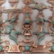 Intricate copper and turquoise metal objects with neoclassical and robotic motifs (tiled)
