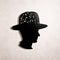 Intricate Cut-out Silhouette Of A Man Wearing A Hat: Found Object Inspired Conceptual Portraiture