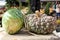 Intricate detail in large pumpkins on burlap bag at outside market