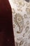 Intricate Elegance Unveiled: Close-Up of a Gilded Embroidery Design at Zons Customs Fortress City Museum . Floral pattern and