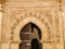 Intricate Islamic Art Carvings on the Entrance Gate of a Madrasa