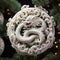 Intricate ivory carving of a Chinese zodiac dragon curled up on a pine tree