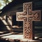 Intricate and ornate carved wooden cross, set in chapel environment