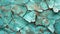 The intricate pattern of cracked turquoise paint reveals the passage of time on a textured surface. A beautiful decay