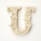 Intricately Carved Ivory Letter U On White Background