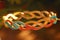 Intricately Designed Gold Bracelet With Colorful Pattern. Generative AI