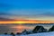 Inuit houses at the fjord with sunset view over the mountains, N