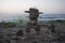 Inukshuk from Native American culture standing in front of the sea