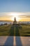 Inukshuk stone sculpture in the sunset time at English Bay Beach, Vancouver City, Canada.