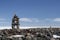 Inuksuk landmark with frozen bay in the background