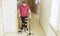 Invalid in orthosis walking with support of two walking cane